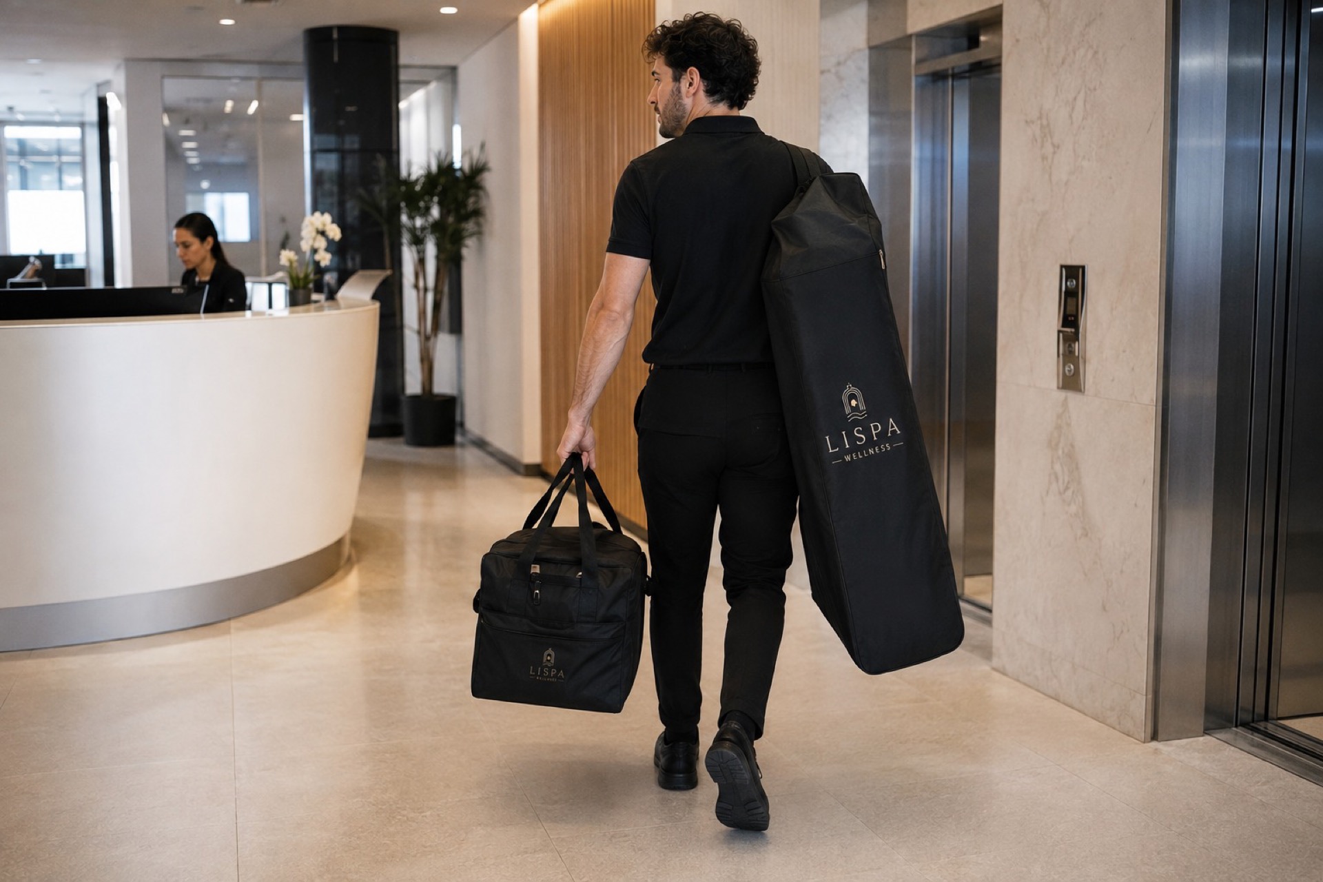 Lispa therapist arriving at a corporate office lobby carrying a portable massage chair and equipment bag